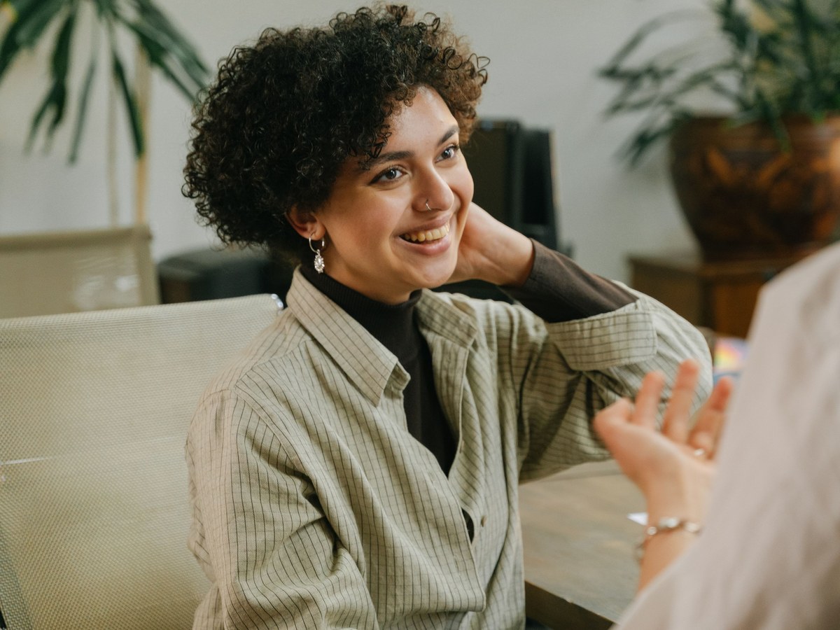 Warm, genuine smile in conversation